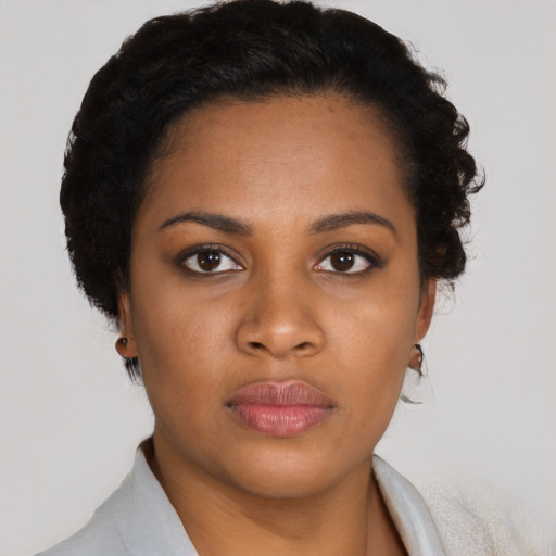 Neutral black young-adult female with short  black hair and brown eyes