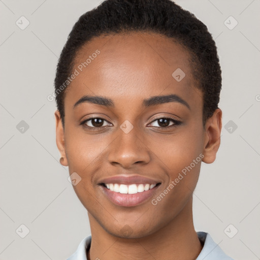 Joyful black young-adult female with short  brown hair and brown eyes