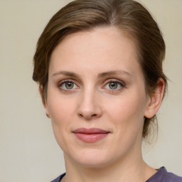 Joyful white young-adult female with medium  brown hair and green eyes