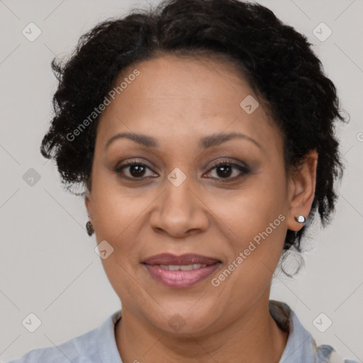 Joyful black adult female with short  brown hair and brown eyes