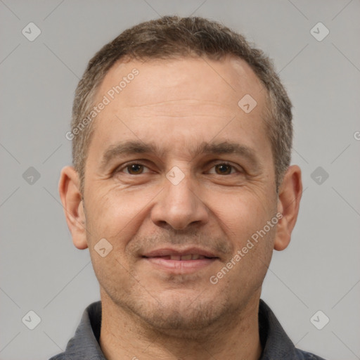 Joyful white adult male with short  brown hair and brown eyes