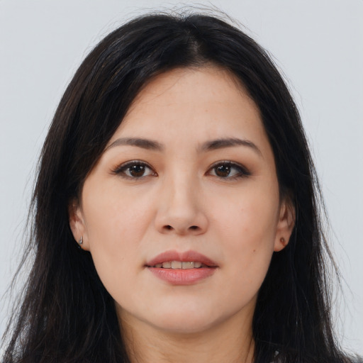 Joyful asian young-adult female with long  brown hair and brown eyes