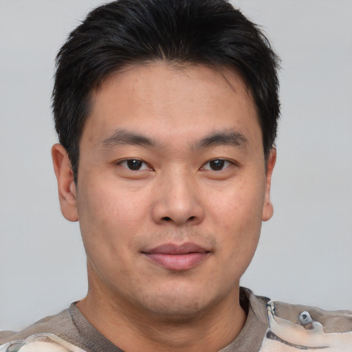 Neutral asian young-adult male with short  brown hair and brown eyes