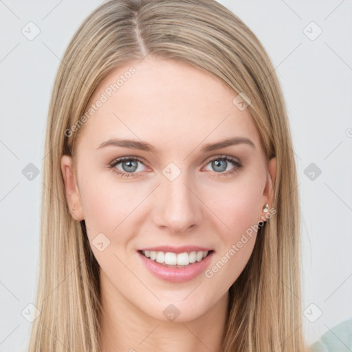 Joyful white young-adult female with long  brown hair and grey eyes