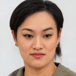 Joyful asian young-adult female with medium  black hair and brown eyes