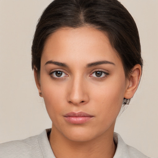 Neutral white young-adult female with medium  brown hair and brown eyes