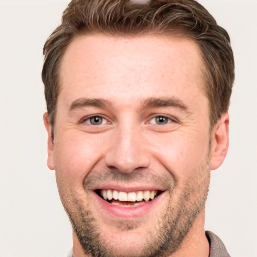 Joyful white adult male with short  brown hair and brown eyes