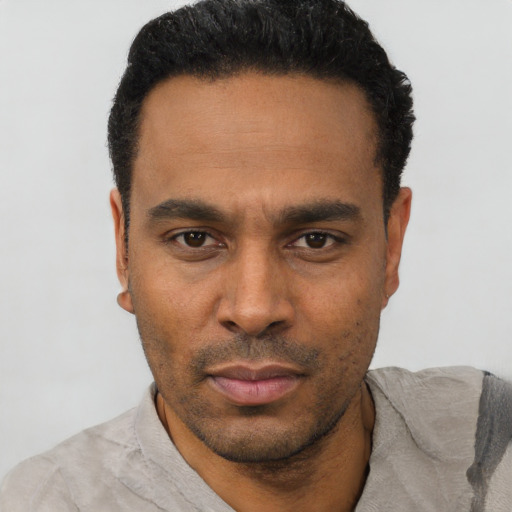 Neutral latino young-adult male with short  black hair and brown eyes