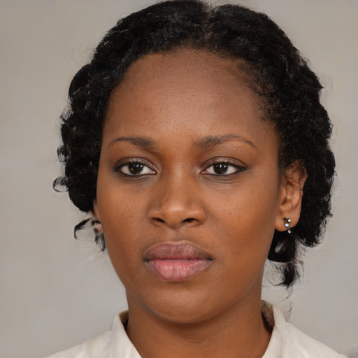 Neutral black young-adult female with medium  black hair and brown eyes