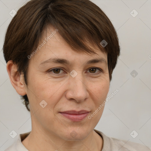 Joyful white adult female with short  brown hair and brown eyes