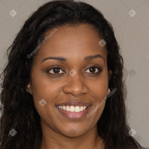 Joyful black young-adult female with long  brown hair and brown eyes