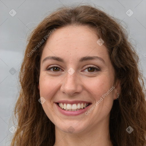 Joyful white young-adult female with long  brown hair and green eyes