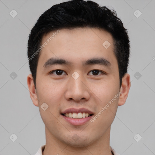 Joyful white young-adult male with short  black hair and brown eyes