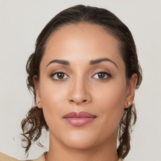 Joyful white young-adult female with long  brown hair and brown eyes