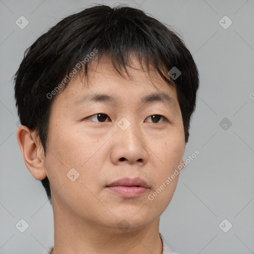 Neutral asian young-adult male with short  brown hair and brown eyes