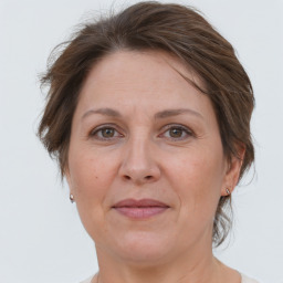 Joyful white adult female with short  brown hair and brown eyes