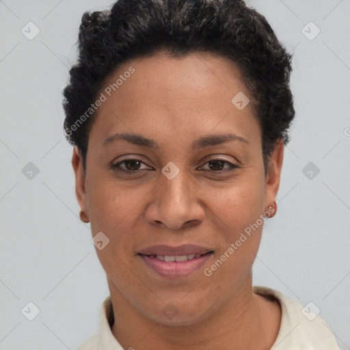 Joyful latino adult female with short  brown hair and brown eyes