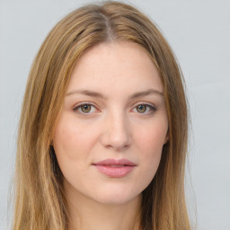 Joyful white young-adult female with long  brown hair and green eyes