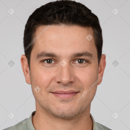 Joyful white young-adult male with short  brown hair and brown eyes