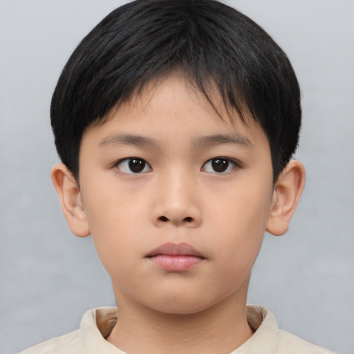 Neutral asian child male with short  brown hair and brown eyes