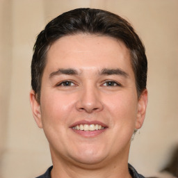 Joyful white young-adult male with short  brown hair and brown eyes