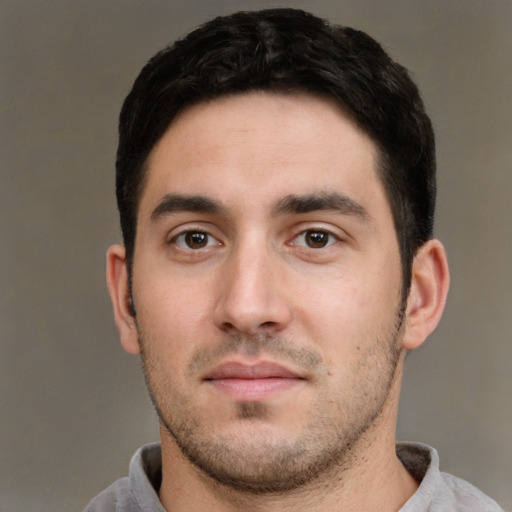 Neutral white young-adult male with short  black hair and brown eyes