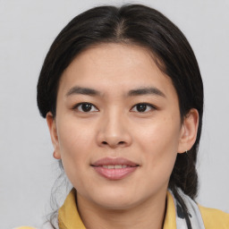 Joyful asian young-adult female with medium  brown hair and brown eyes