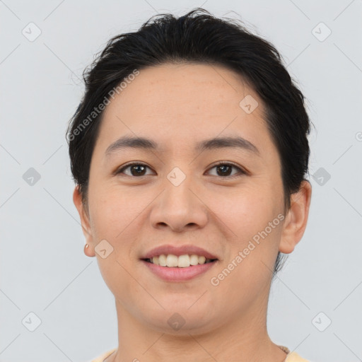 Joyful asian young-adult female with short  brown hair and brown eyes