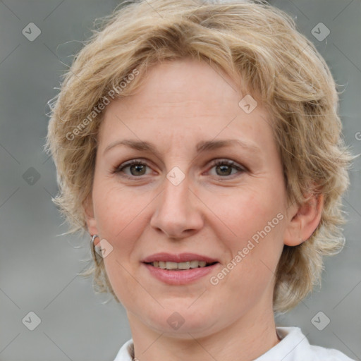 Joyful white adult female with medium  brown hair and blue eyes