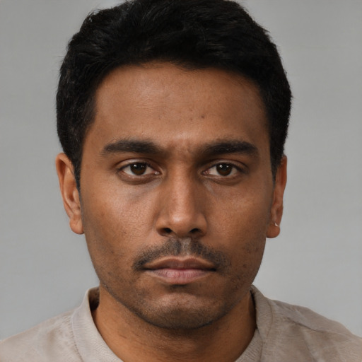Neutral latino young-adult male with short  brown hair and brown eyes