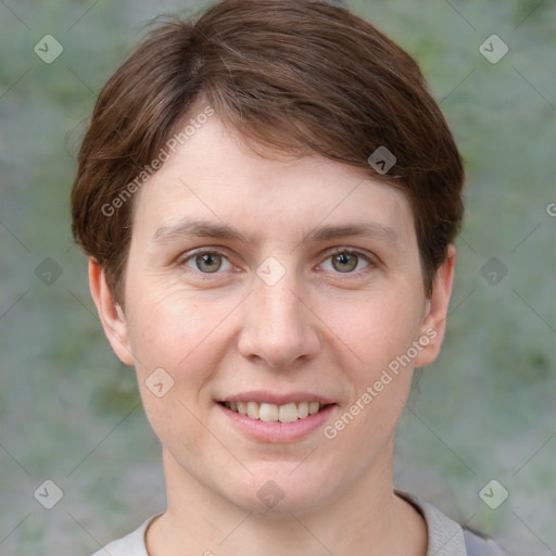 Joyful white young-adult female with short  brown hair and grey eyes