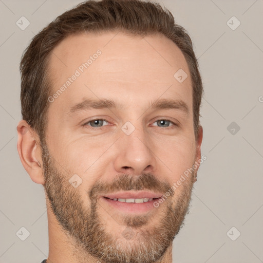 Joyful white adult male with short  brown hair and brown eyes