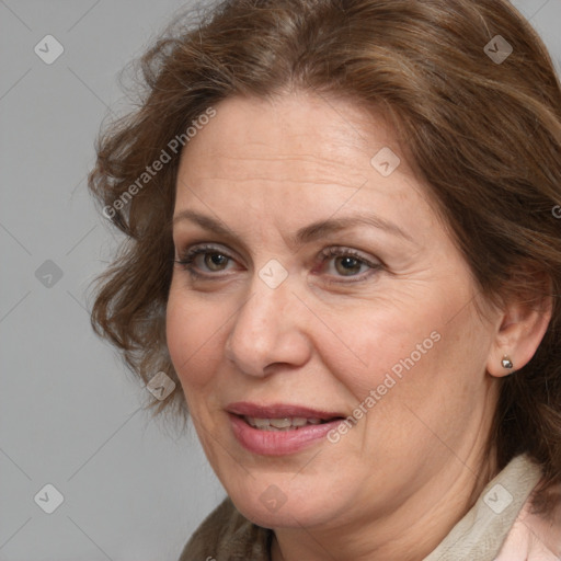 Joyful white adult female with medium  brown hair and grey eyes