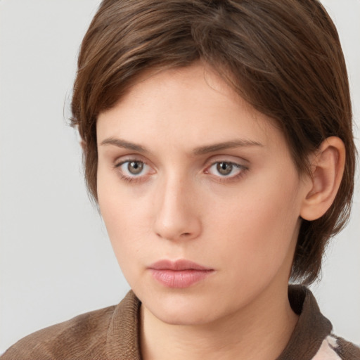 Neutral white young-adult female with short  brown hair and grey eyes