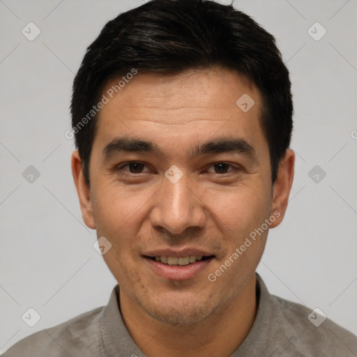 Joyful white young-adult male with short  black hair and brown eyes