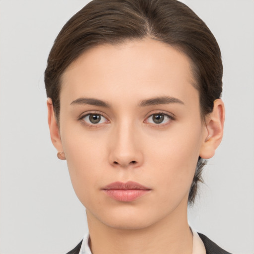 Neutral white young-adult female with medium  brown hair and brown eyes