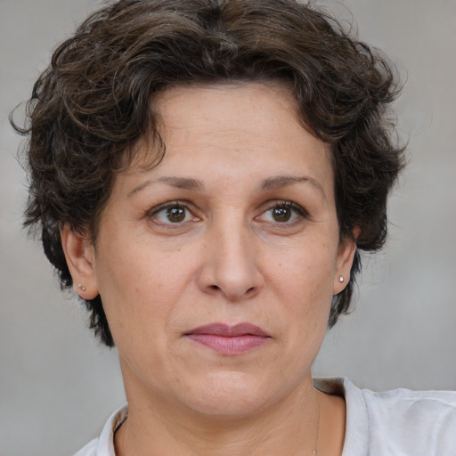 Joyful white adult female with short  brown hair and brown eyes