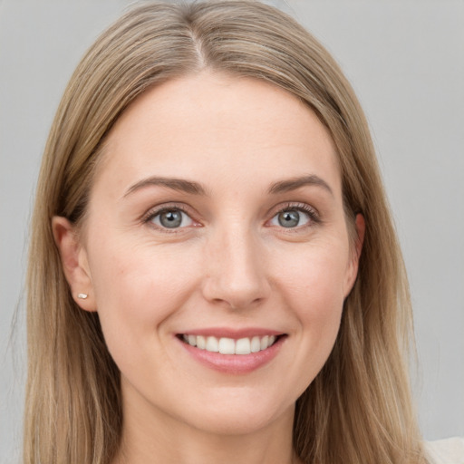 Joyful white young-adult female with long  brown hair and grey eyes