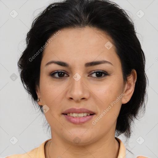 Joyful latino young-adult female with medium  brown hair and brown eyes