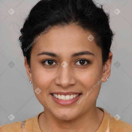 Joyful latino young-adult female with short  brown hair and brown eyes