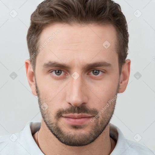 Neutral white young-adult male with short  brown hair and grey eyes