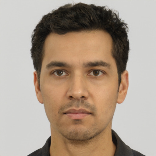 Neutral white young-adult male with short  black hair and brown eyes