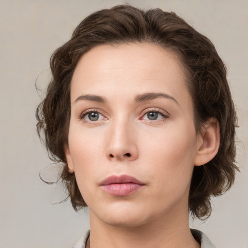 Neutral white young-adult female with medium  brown hair and green eyes