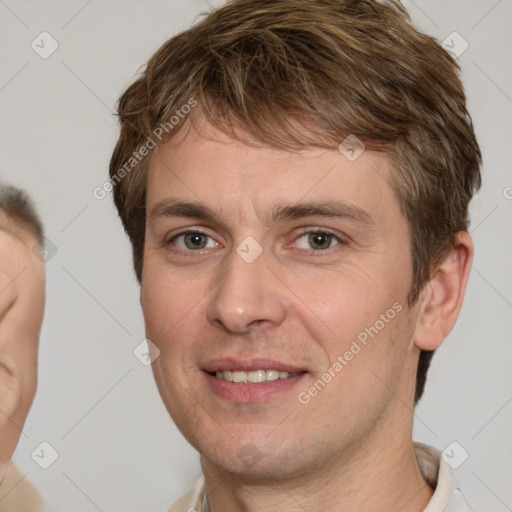 Joyful white adult male with short  brown hair and brown eyes