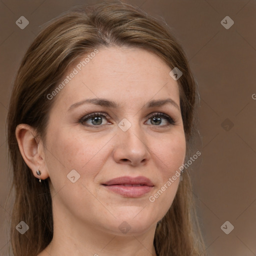 Joyful white adult female with long  brown hair and grey eyes