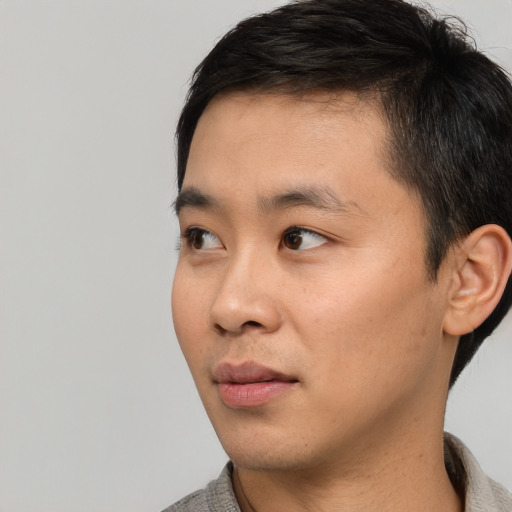 Neutral asian young-adult male with short  black hair and brown eyes