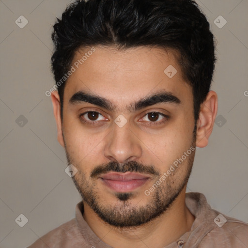 Joyful latino young-adult male with short  brown hair and brown eyes