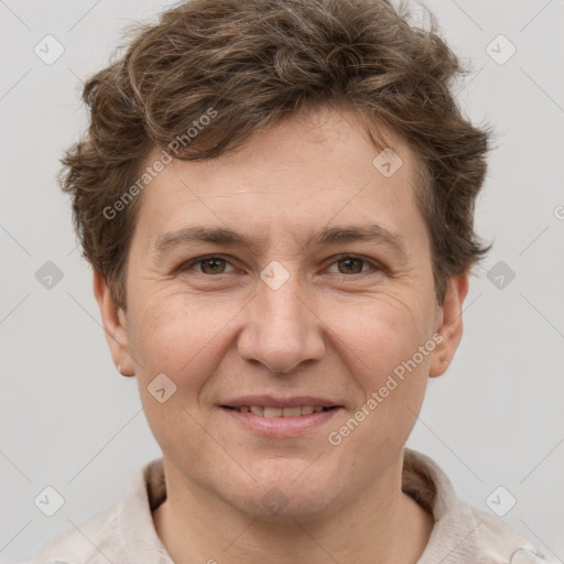 Joyful white adult male with short  brown hair and grey eyes