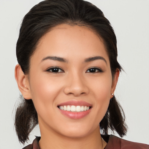 Joyful white young-adult female with medium  brown hair and brown eyes