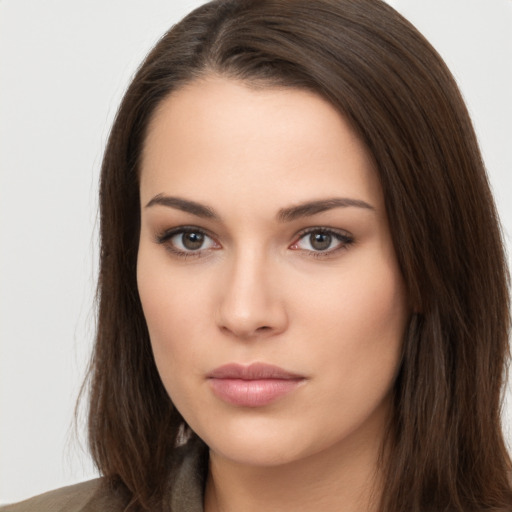 Neutral white young-adult female with long  brown hair and brown eyes